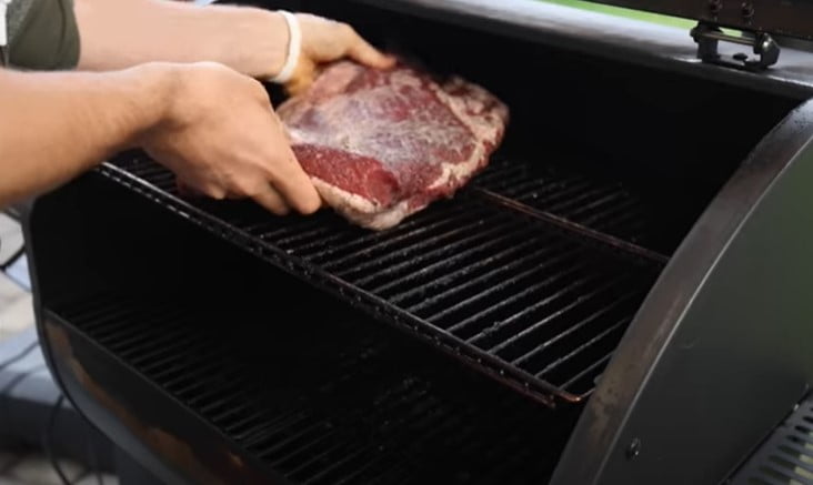 How to use pellet smokers-placing meat on grill
